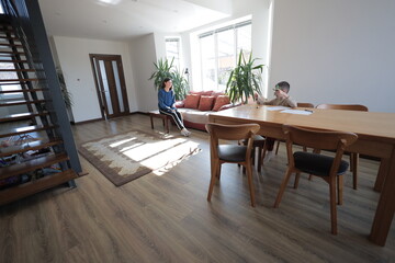 Mother and a boy child play together indoors