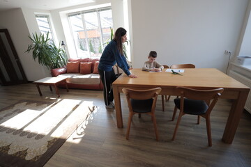 Mother and a boy child play together indoors