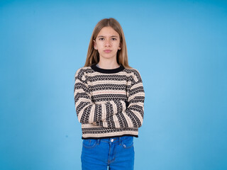 beautiful caucasian girl wearing striped sweater Pointing down with fingers showing advertisement, surprised face and open mouth