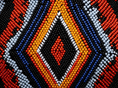 Zulu beadwork with colors blending in bold geometric patterns showing precise identity