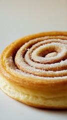 Fototapeta premium Deliciously Swirling Cinnamon Roll With Sugar on Top in a Close-Up View