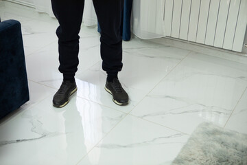 Obraz premium man in black leather boots