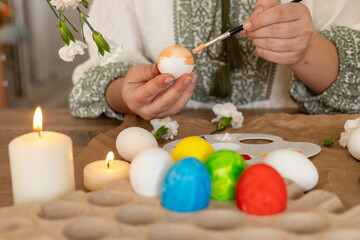 Decorating traditional Easter eggs with care in a springtime setting
