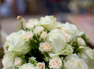 Bouquet of light pink and white roses. Wedding party in a marine style.