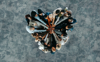 Top view of a a heart shape of people, showing unity and teamwork