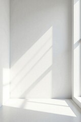 Obraz premium Sunlight Illuminates a Pristine White Room Corner, Offering a Simple and Elegant Blank Canvas for Design Inspiration