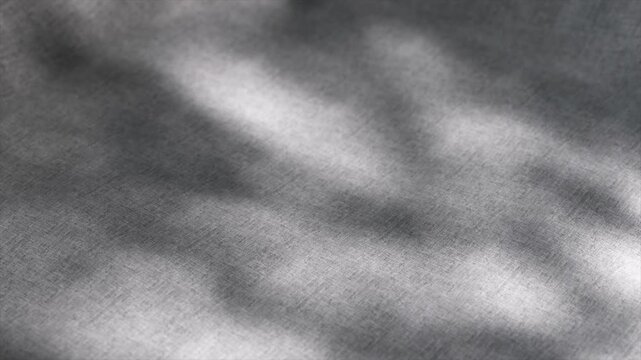 Fabric surface gracefully transforming, creating concave shape with shifting shadows, delivering elegant abstract visual experience through subtle, dynamic motion