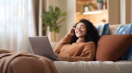 Relaxing woman working on laptop at home cozy living room lifestyle image bright environment comfortable viewpoint