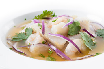 Traditional Peruvian ceviche sea bass fillet isolated on white background. Close up