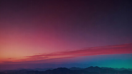 Obraz premium Mountains silhouetted against vibrant sunset sky