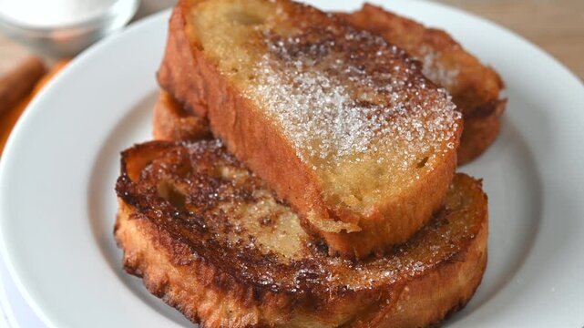Traditional Spanish torrijas for Holy Week on wooden table. French Toast.