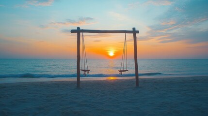 Serene beach sunset with wooden swings at the shore