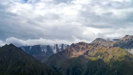 rocky mountain peaks in the clouds. cloud cover in the mountains