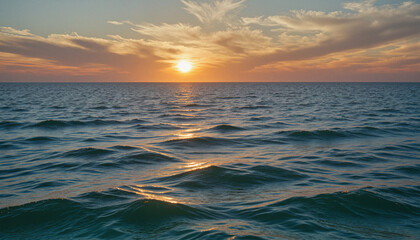 Obraz premium Endless rolling waves at sunrise, warm golden hues reflecting on tranquil ocean