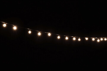 string of christmas lights on a transparent background