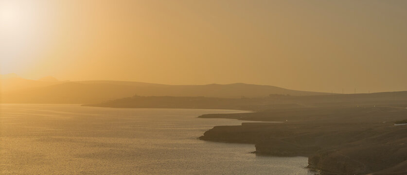 Aerial view of sotavento beach during a calima sandstorm at sunset, Fuerteventura Island, Canary Islands, Spain.