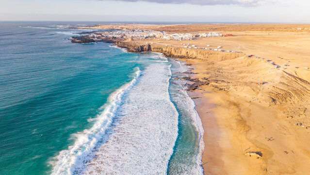 Aerial view of el cotillo town with beautiful beaches and waves, Fuerteventura Island, Canary Islands, Spain.