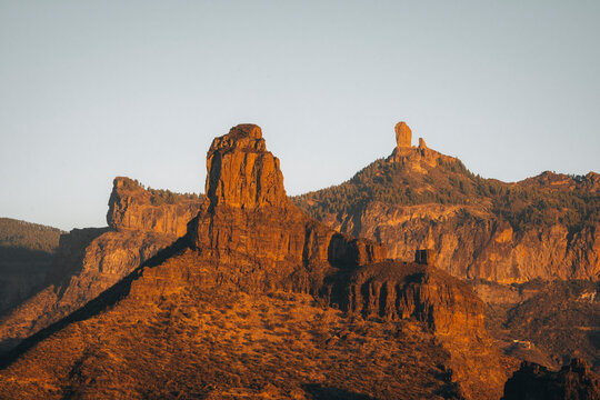 Aerial view of majestic rock formations and rugged mountains at sunset, Rocco Noublo, Gran Canaria, Canary Islands, Spain.