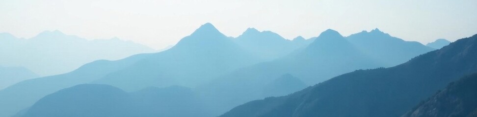 Fototapeta premium Dense fog obscures jagged mountain silhouettes , horizon, shadows, mysterious