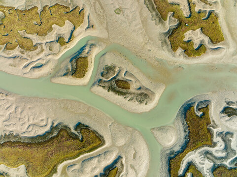 Aerial view of the beautiful Bahia de Cadiz with meandering rivers and wetlands, Chiclana de la Frontera, Cadiz, Spain.