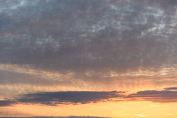 Intense orange color in a dawn sky with clouds