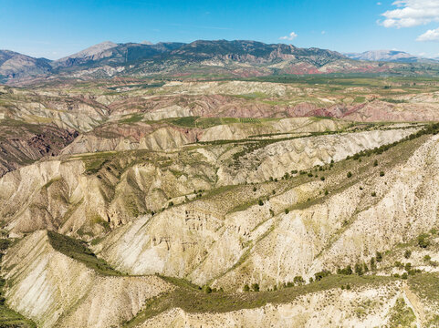 Aerial view of the majestic Gorafe Desert with rugged mountains and a serene valley, Pozo Alcon, Jaen, Spain.