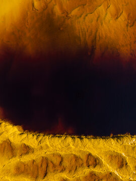 Aerial view of the vibrant and colorful Rio Tinto with striking patterns and textures, Minas de Riotinto, Huelva, Spain.