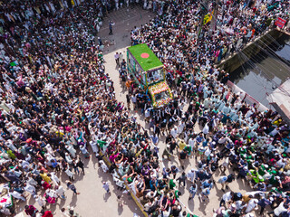 Chittagong, Bangladesh - 16 September 2024: Aerial view of vibrant milad un nabi celebration with colorful flags and a multitude of people in procession, Chittagong, Chittagong, Bangladesh.