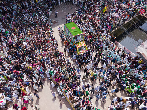 Chittagong, Bangladesh - 16 September 2024: Aerial view of vibrant milad un nabi celebration with colorful flags and a multitude of people in procession, Chittagong, Chittagong, Bangladesh.