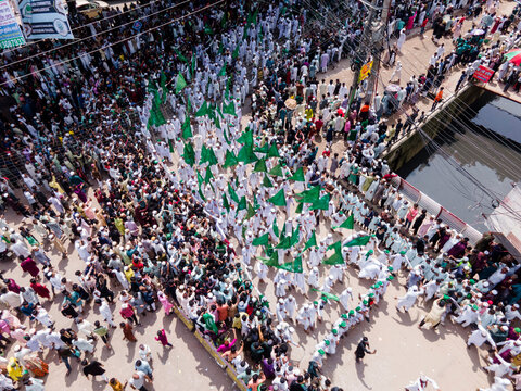 Chittagong, Bangladesh - 16 September 2024: Aerial view of a vibrant procession celebrating Milad un Nabi with colorful flags and lights, Chittagong, Chittagong, Bangladesh.