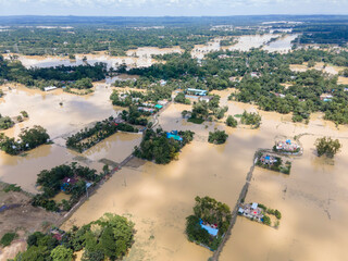 Aerial view of flooded village with submerged homes and fields, Chhagalnaiya, Feni, Chittagong, Bangladesh.