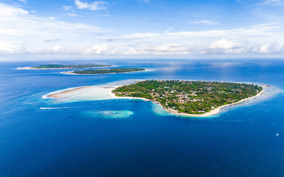 Aerial drone view of the three Gili islands near Lombok on a clear sunny day, Indonesia