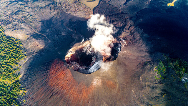Aerial drone view of active Rinjani volcano during sunrise on the island of Lombok, Indonesia