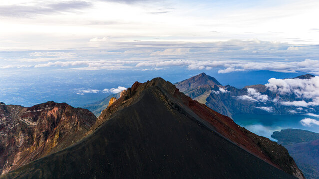 Aerial drone view of the top of active Rinjani volcano during sunrise on the island of Lombok, Indonesia