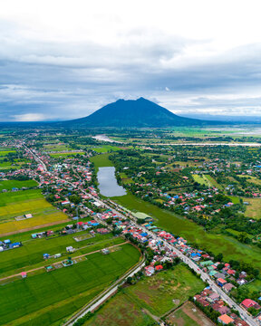 Aerial drone view of Mt. Arayat with busy street, North of Manilla, The Philippines