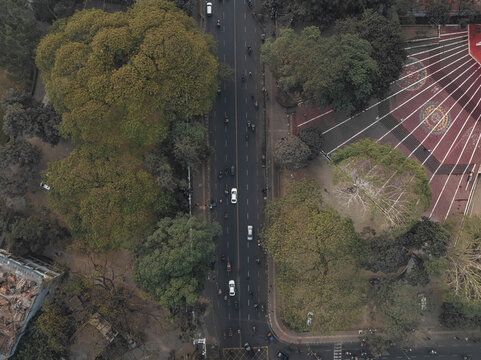 Aerial view of central shaheed minar surrounded by urban landscape and greenery, Shahbag, Dhaka, Bangladesh.