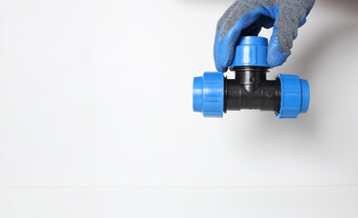 plumbing clutch in a blue glove