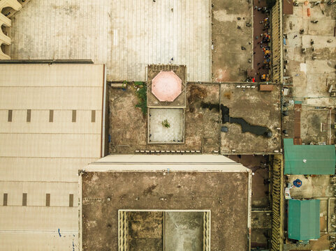 Aerial view of baitul mukarram national mosque with its geometric roof and courtyard, Paltan Thana, Dhaka, Bangladesh.