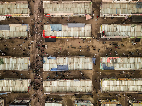 Aerial view of a bustling book fair with colorful stalls and tents, Shahbag, Dhaka, Bangladesh.
