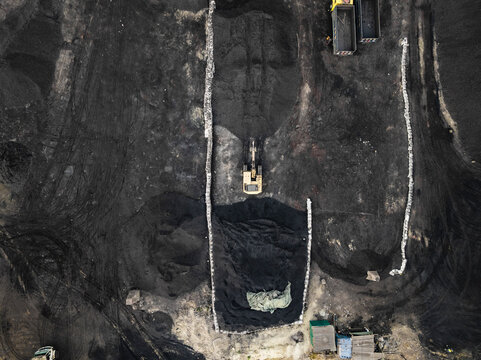 Aerial view of coal factory with crane and excavators in construction, Amin Bazar, Savar, Dhaka, Bangladesh.