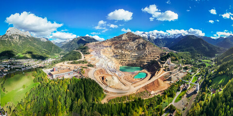 Aerial view of industrial iron ore mine in a panoramic mountain landscape, Erzberg, Styria, Austria.