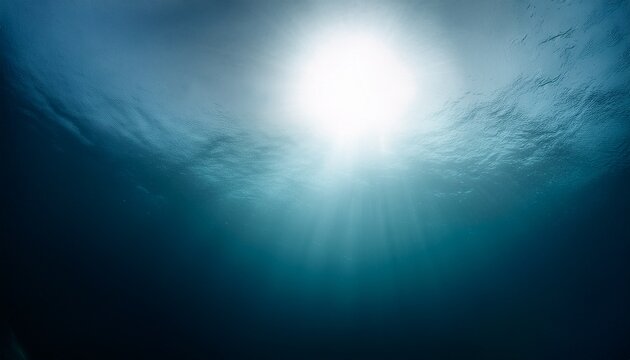 Ethereal underwater view looking up to the light. Ideal for ocean themes, deep sea concepts, and mysterious designs.
