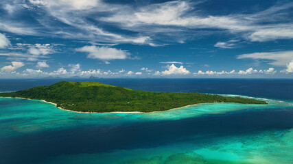 Aerial view of a beautiful tropical island with clear turquoise lagoon and lush palms, Port Vila, Efate, Vanuatu.