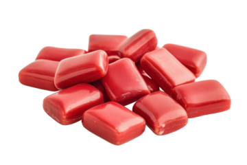 A close up shot of a pile of rectangular red candies on a white background in a studio setting view