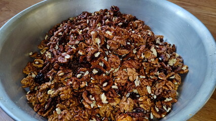 The photos show a lot of walnuts. A lot of walnuts piled up