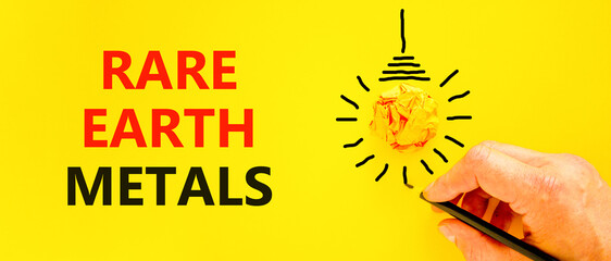 Rare earth metals symbol. Concept words Rare earth metals on beautiful yellow paper. Beautiful...