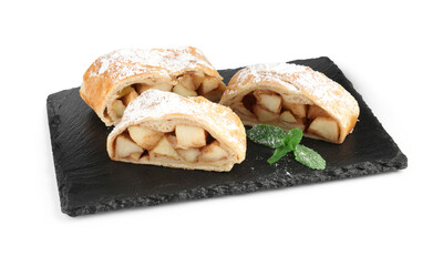 Pieces of tasty apple strudel with powdered sugar and mint isolated on white