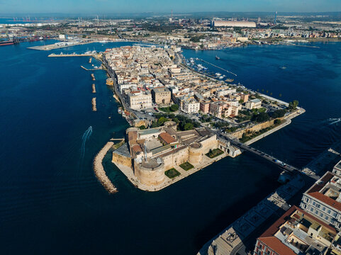 Aerial view of vibrant coastal cityscape with historic architecture and scenic waterfront, Taranto, Taranto, Italy.