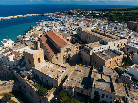 Aerial view of the historic old town with medieval architecture and coastal scenery, Otranto, Lecce, Italy.