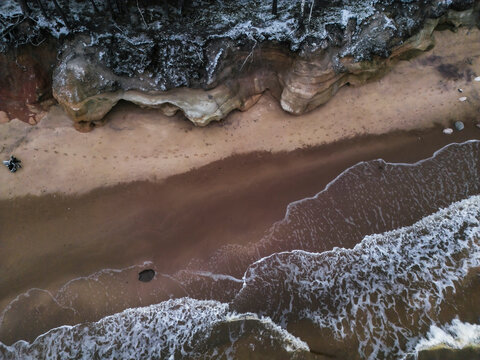 Aerial view of the serene and picturesque Baltic Sea coastline with sandy beaches and rugged cliffs, Salacgriva Parish, Limbazi, Latvia.